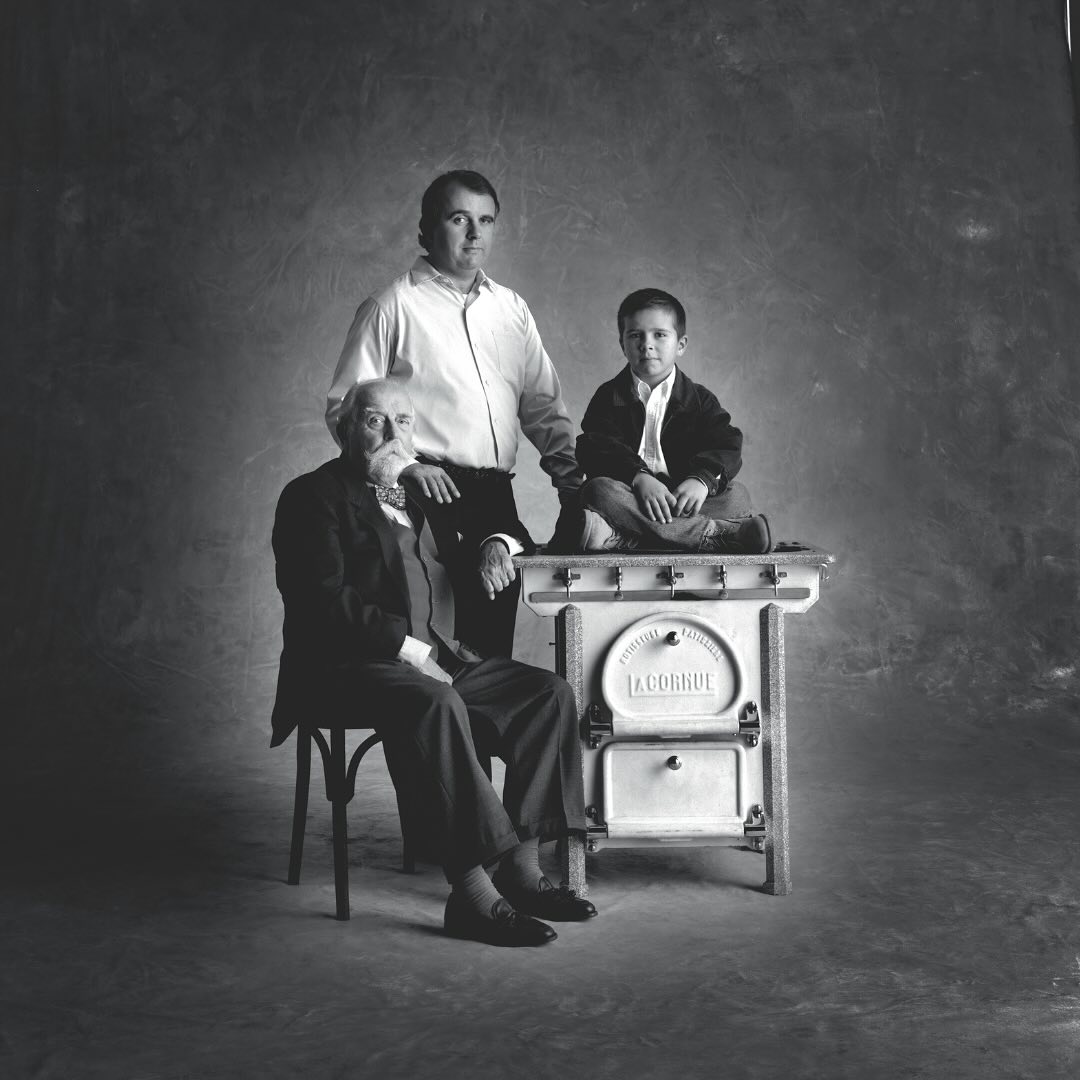 Albert Dupuy (bottom left), his son Andre Dupuy (standing), and his grandson Xavier Dupuy